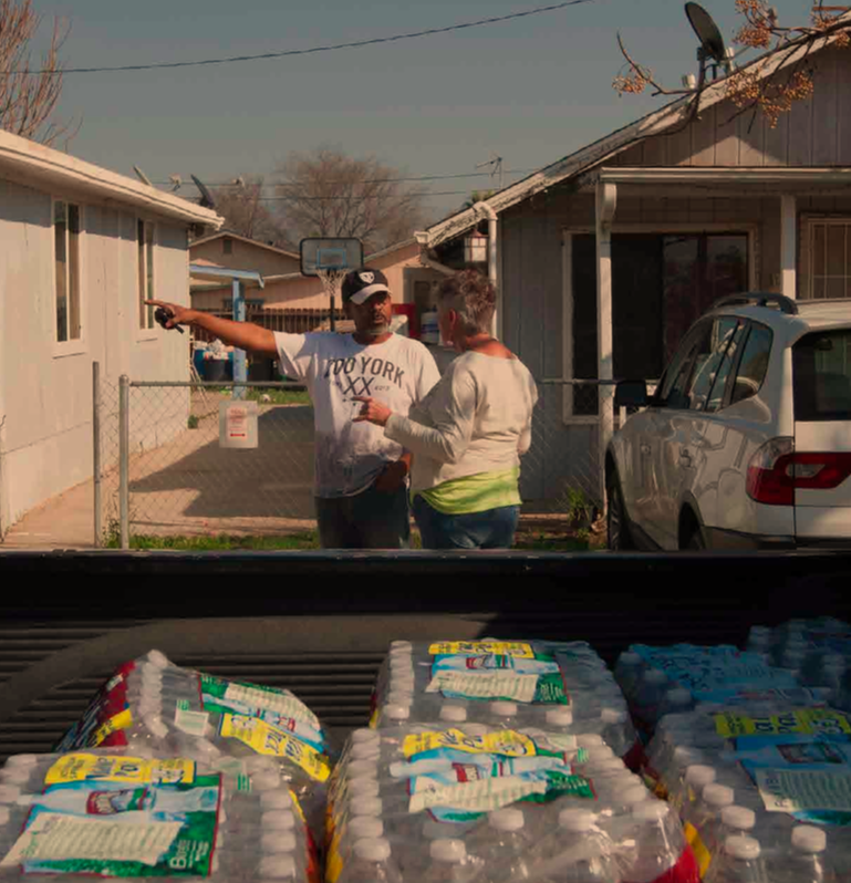 East Porterville residents distribute water during drought after local wells run dry.